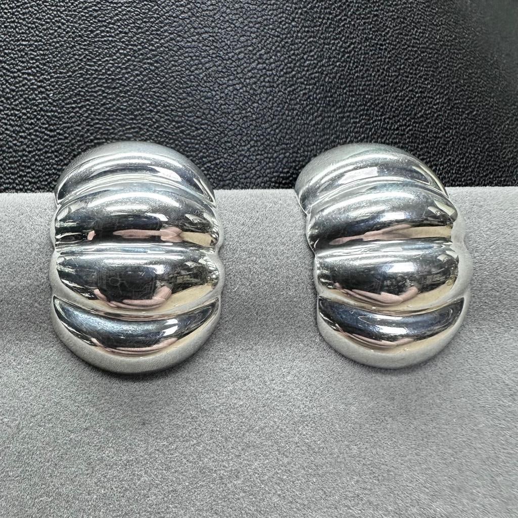 Sterling Silver Ribbed Clip-On Earrings: This piece of jewelry has been tested and researched prior to listing. Please view all our pictures they are part of our description. DETAILS: Metal - Sterling Silver Color - Silver Stones - none Hall