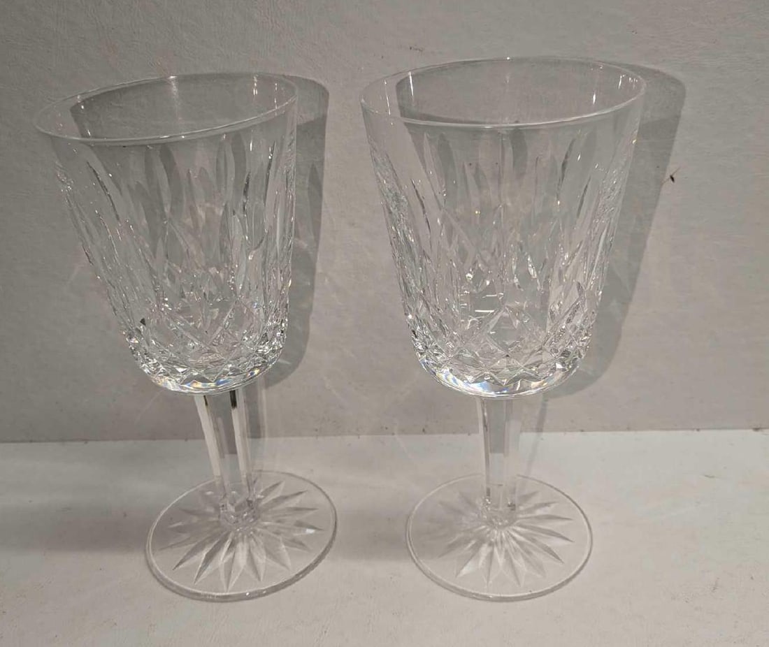 2 Waterford Crystal Lismore Claret Wine Glasses: 2 Waterford Crystal Lismore Claret Wine Glasses. Each is approx 3 1/4" x 3 1/4" x 6 7/8" and the total weight is 1.76lb. The glasses have no chips or cracks.