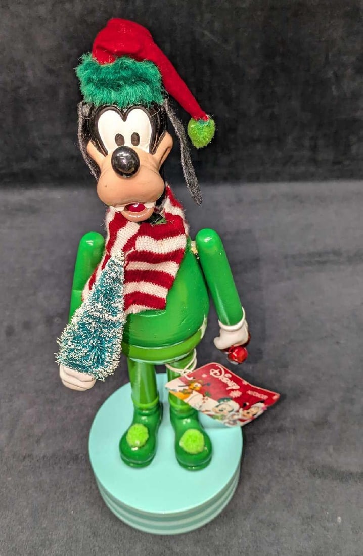Disney Decorative Goofy Wood Nutcracker: Disney Decorative Goofy Wood Nutcracker. This was originally sold at JC Penney. This is approx 4 7/8" x 4 7/8" x 14" and it weighs 1.98lb. The nutcrackers has some scratches and a stitch c