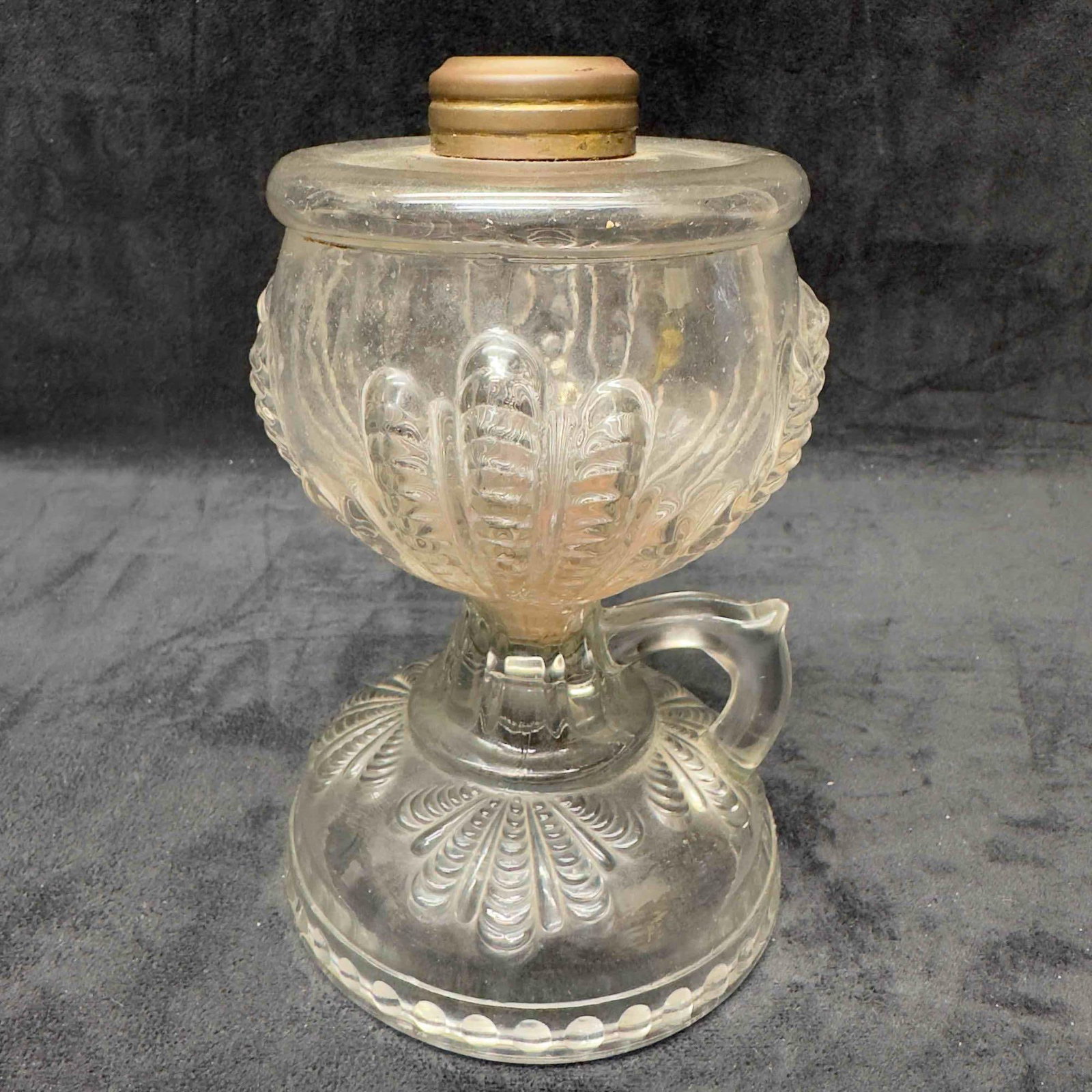 Glass Oil Lamp Vase with Handle Vintage Antique: Glass Oil Lamp Vase with Handle Vintage Antique. This oil lamp features raised glass design all around with small handle. No chips or cracks in the glass. This item is in good pre-owned, previously di