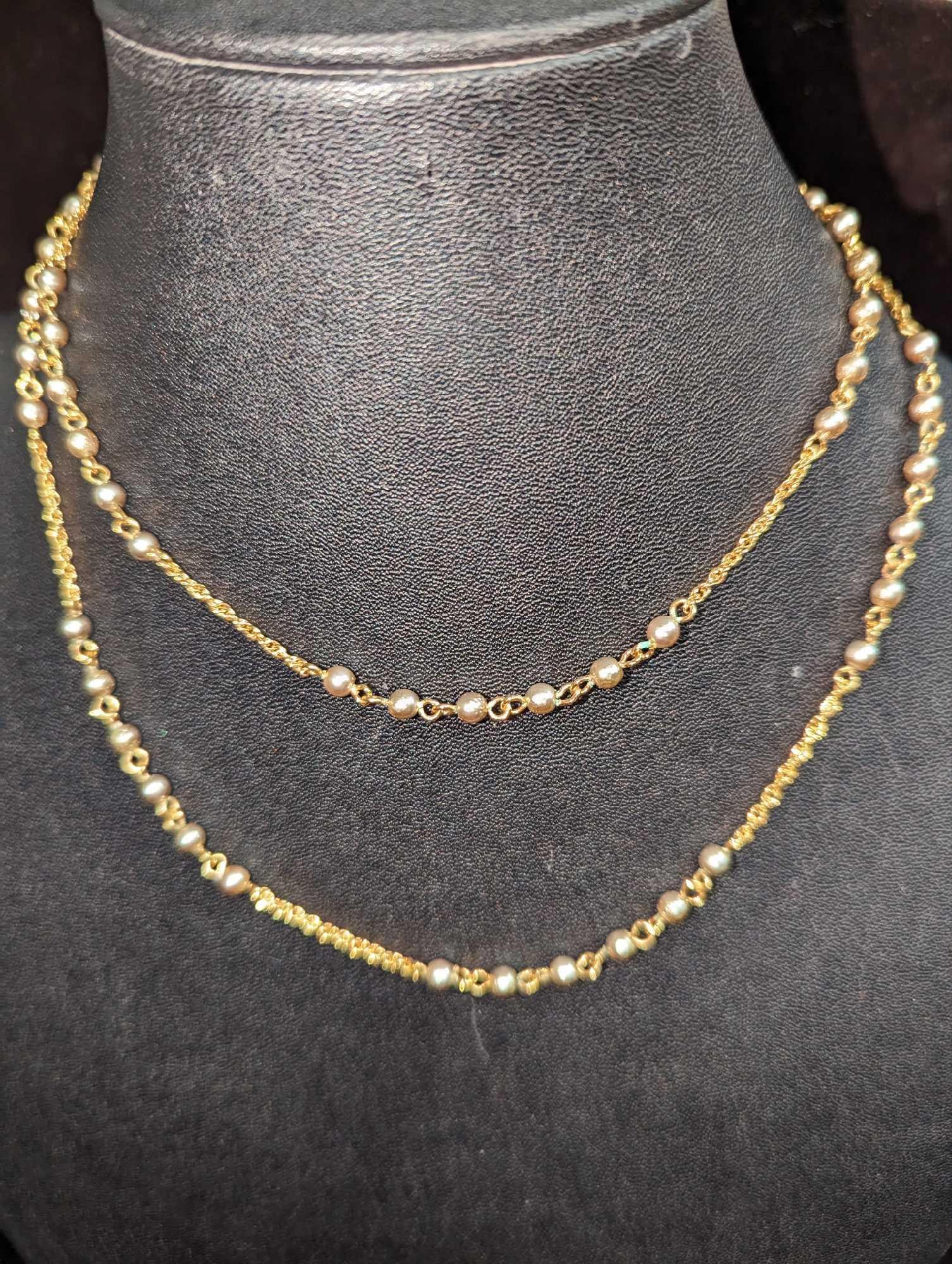 Norman Miller Goldtone Necklace With Faux Pearls: Norman Miller Goldtone Necklace With Faux Pearls. This is approx 31". It comes in a bag that is approx 2" x 1/8" x 2 1/2" and it weighs 0.02lb.