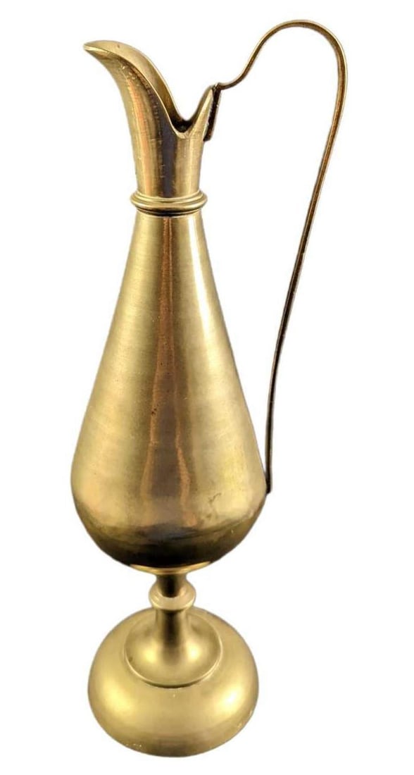Vintage Brass 14 1/2" Indian Pitcher: Vintage Brass Indian Pitcher. The pitcher is 4" x 4" x 14 1/2" and it weighs 2.22lbs. The pitcher is in a good, vintage condition with light tarnish and scratches. Please see the images as
