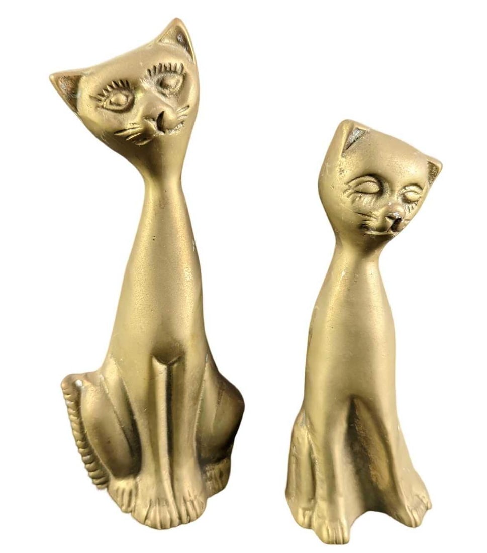 JB Two Vintage 1970s Brass Stylized Cat Figurines: The taller if the cats is approx 3" x 2" x 6 1/2" and the other cat is approx 2" x 2" x 5 1/2". Together they weigh 1.26lb. Both cats are in good, vintage condition with light