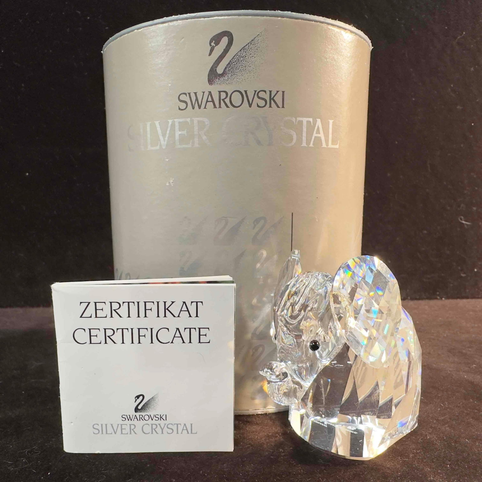 Swarovski Crystal Elephant Figurine 7640 NR 055 000 B: Swarovski Clear Crystal Glass Elephant Figurine. This figure is a beautiful crystal glass art piece featuring a Elephant from Swarovski Crystal. The item features a beautifully etched art glass piece 