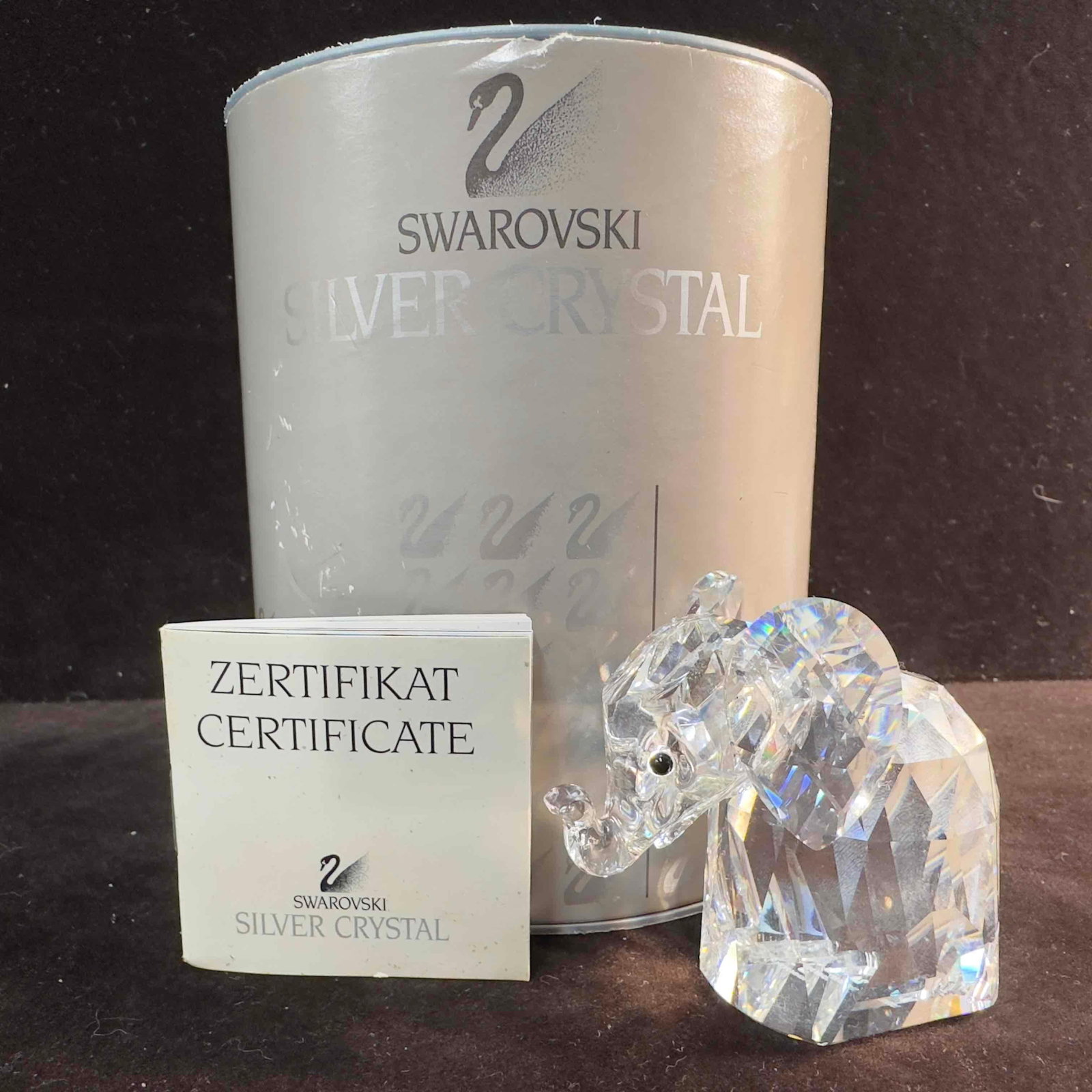 Swarovski Crystal Elephant Figurine 7640 NR 055 000 C: Swarovski Clear Crystal Glass Elephant Figurine. This figure is a beautiful crystal glass art piece featuring a Elephant from Swarovski Crystal. The item features a beautifully etched art glass piece 