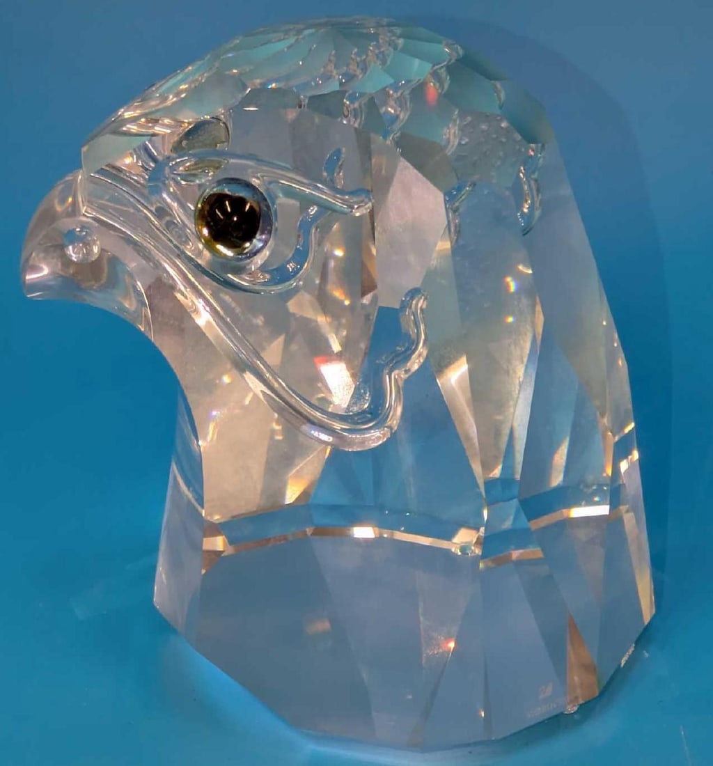 Swarovski Crystal Large Heavy Falcon Head With Box: Swarovski Crystal Large Heavy Falcon Head With Box. The Falcon is approx 3 3/8" x 3 1/2" x 4". It comes with the original box that is approx 8 1/2" x 8 1/2" x 7" and it weighs 