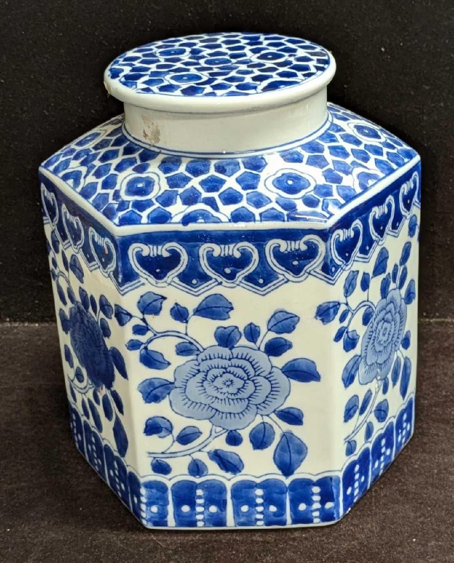 Vintage Porcelain Blue & White Chinese Tea Caddy: Vintage Porcelain Blue & White Chinese Tea Caddy. This is approx 7" x 7" x 8 1/2" and it weighs 3.31lbs. There is some sticker residue on the caddy, along with some small drops of pain