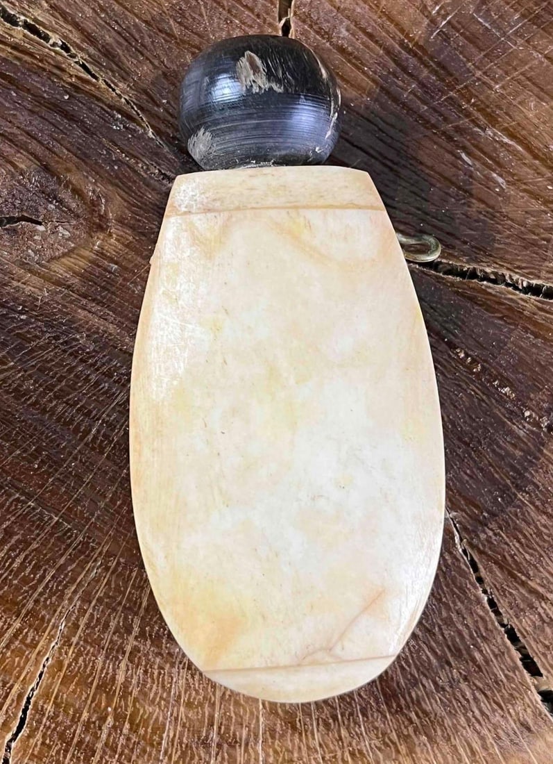 Vintage Bone Carved Perfume Bottle: Vintage Bone Carved Perfume Bottle This perfume bottle is carved from bone with a wooden twist top. There is a little bone stick on the cap that is used for perfume application. This item is in good c
