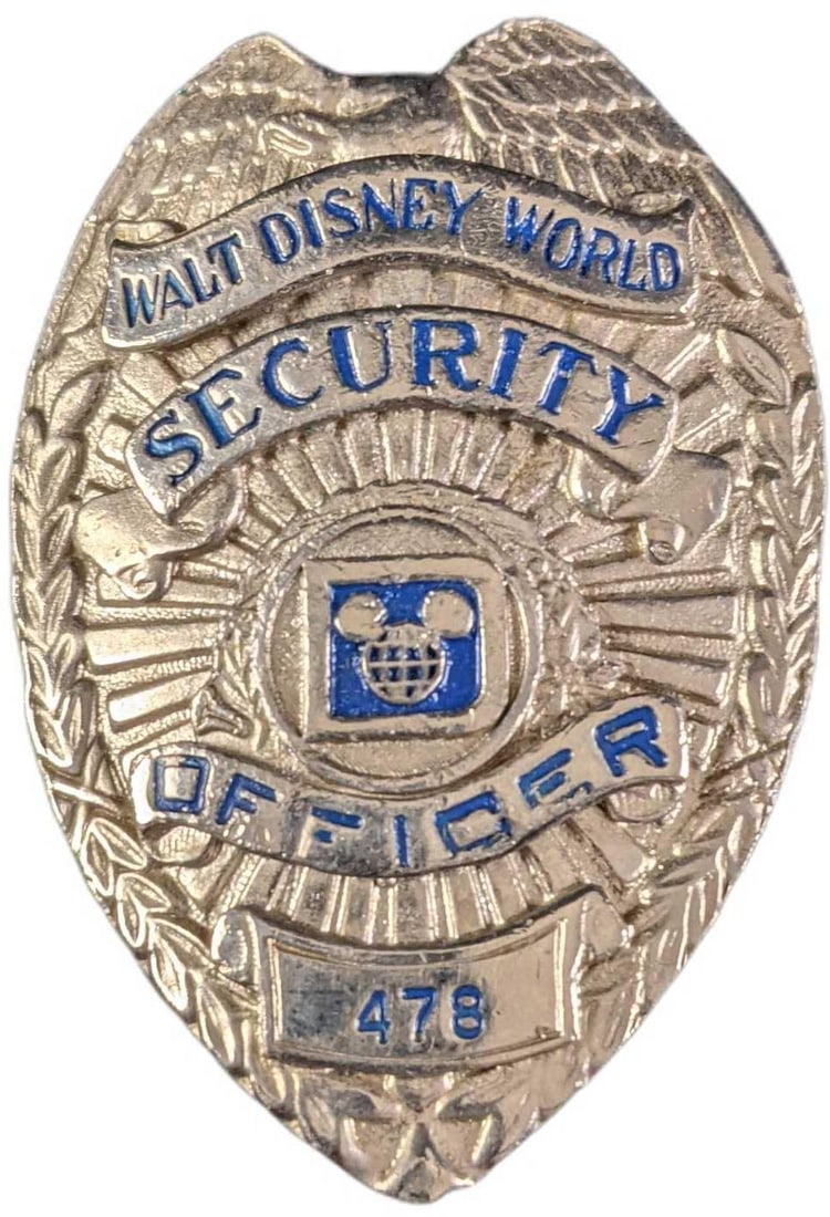 1970s/1980s Disney World Security Metal Badge: 1970's/1980's Disney World Security Metal Badge. Is approx 2 1/4" x 3/4" x 3" and it weighs under one pound at 0.14lb. The metal badge is in a good, vintage condition with some wear and mini scratches