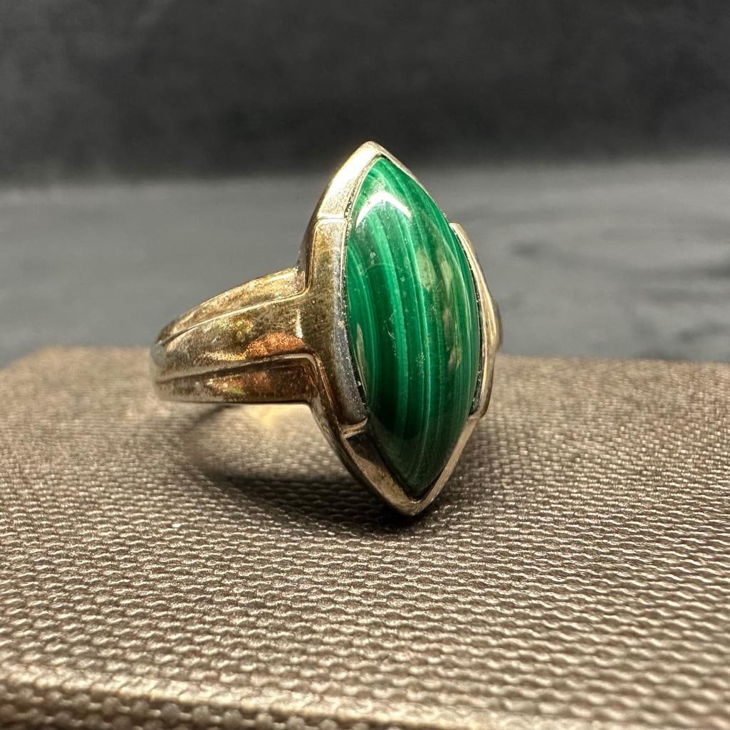 Malachite and Sterling Cocktail Ring: This piece of jewelry has been tested and researched prior to listing. Please view all our pictures they are part of our description. DETAILS: Metal - Sterling Silver Color - Silver Stones - Malachite