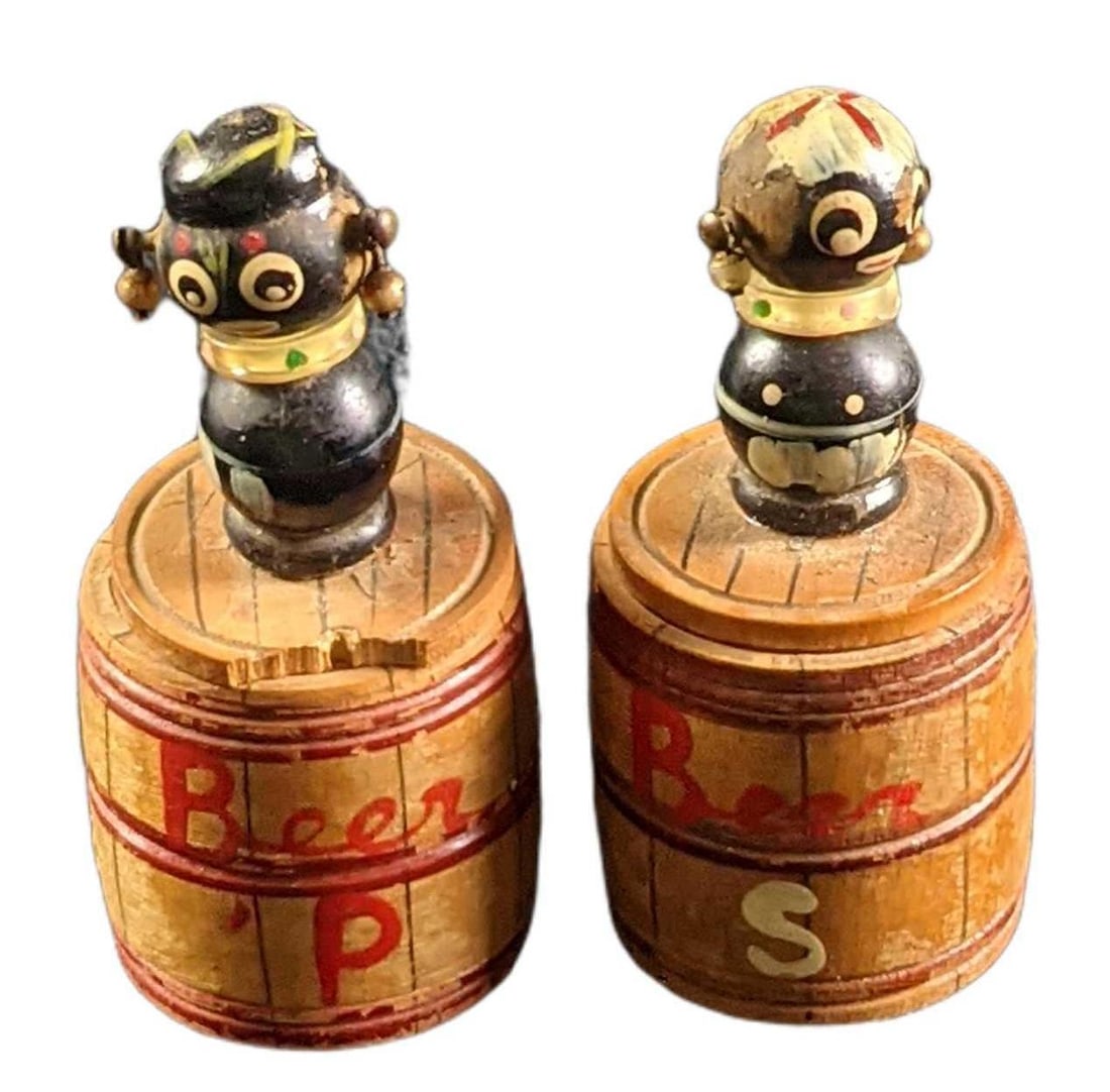 Vintage Japanese Black Baby Beer Barrel Salt & Pepper Shakers: Vintage Japanese Black Baby Beer Barrel Salt & Pepper Shakers. Shakers are approx 1" x 1" x 2". Top slides open for salt & pepper use. All are in a good, vintage condition with the
