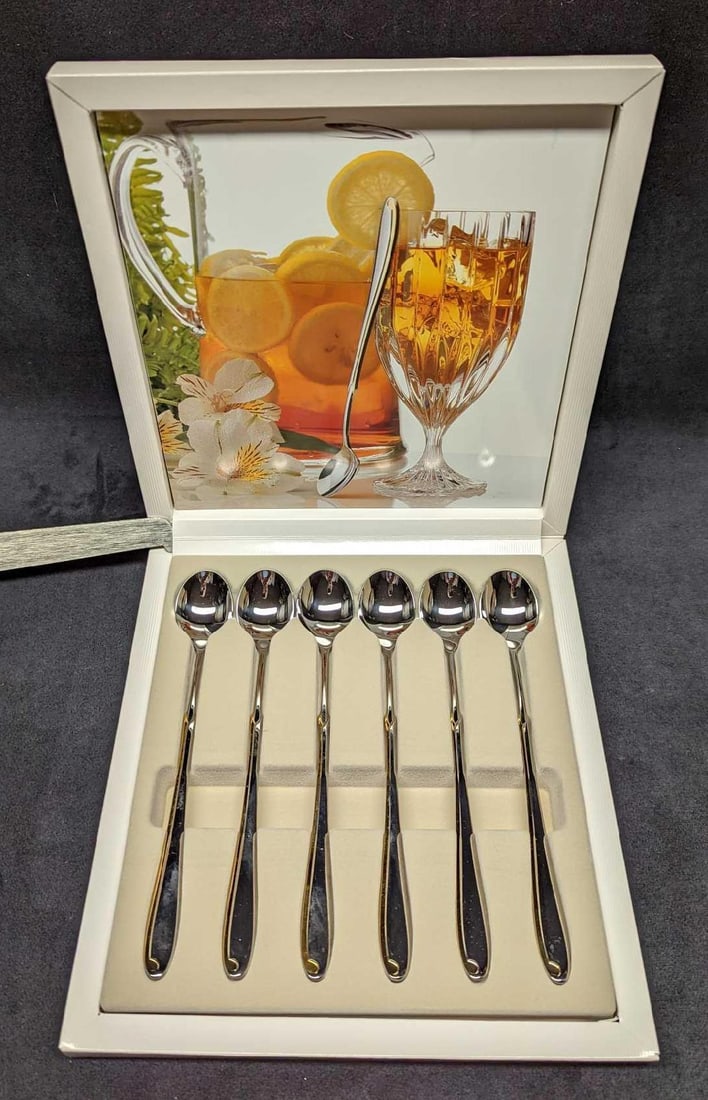 6 Retired Mikasa Estasi Stainless Ice Tea Spoons: 6 Retired Mikasa Estasi Stainless Ice Tea Spoons. Stainless steel with a gold accent. Made in Japan. Both come in the original box which is approx 9" x 9 3/4" x 1 1/4" and it weighs 0.96lb