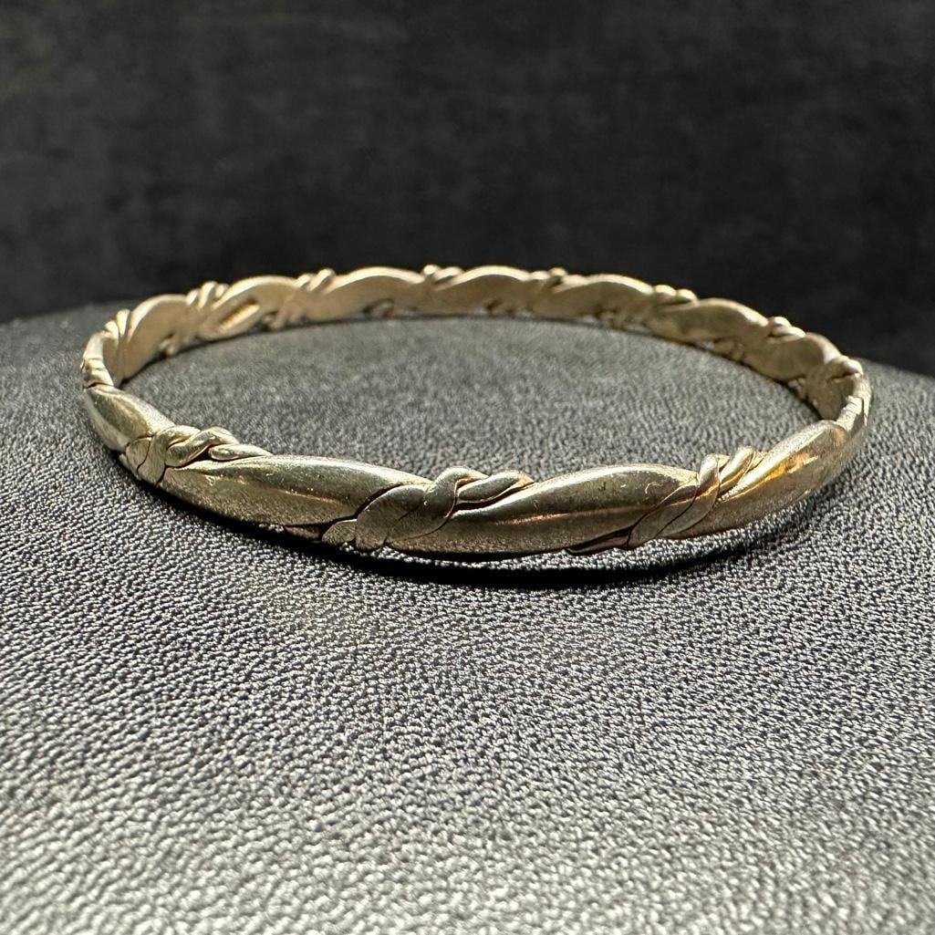 Sterling Silver Twist Bangle B: This piece of jewelry has been tested and researched prior to listing. Please view all our pictures they are part of our description. DETAILS: Metal - Sterling Silver Color - Silver Stones - none Hall
