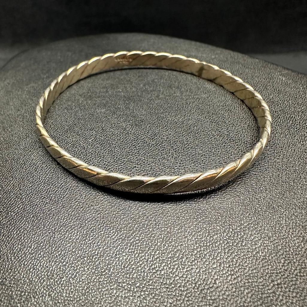 Sterling Silver Twist Bangle C: This piece of jewelry has been tested and researched prior to listing. Please view all our pictures they are part of our description. DETAILS: Metal - Sterling Silver Color - Silver Stones - none Hall