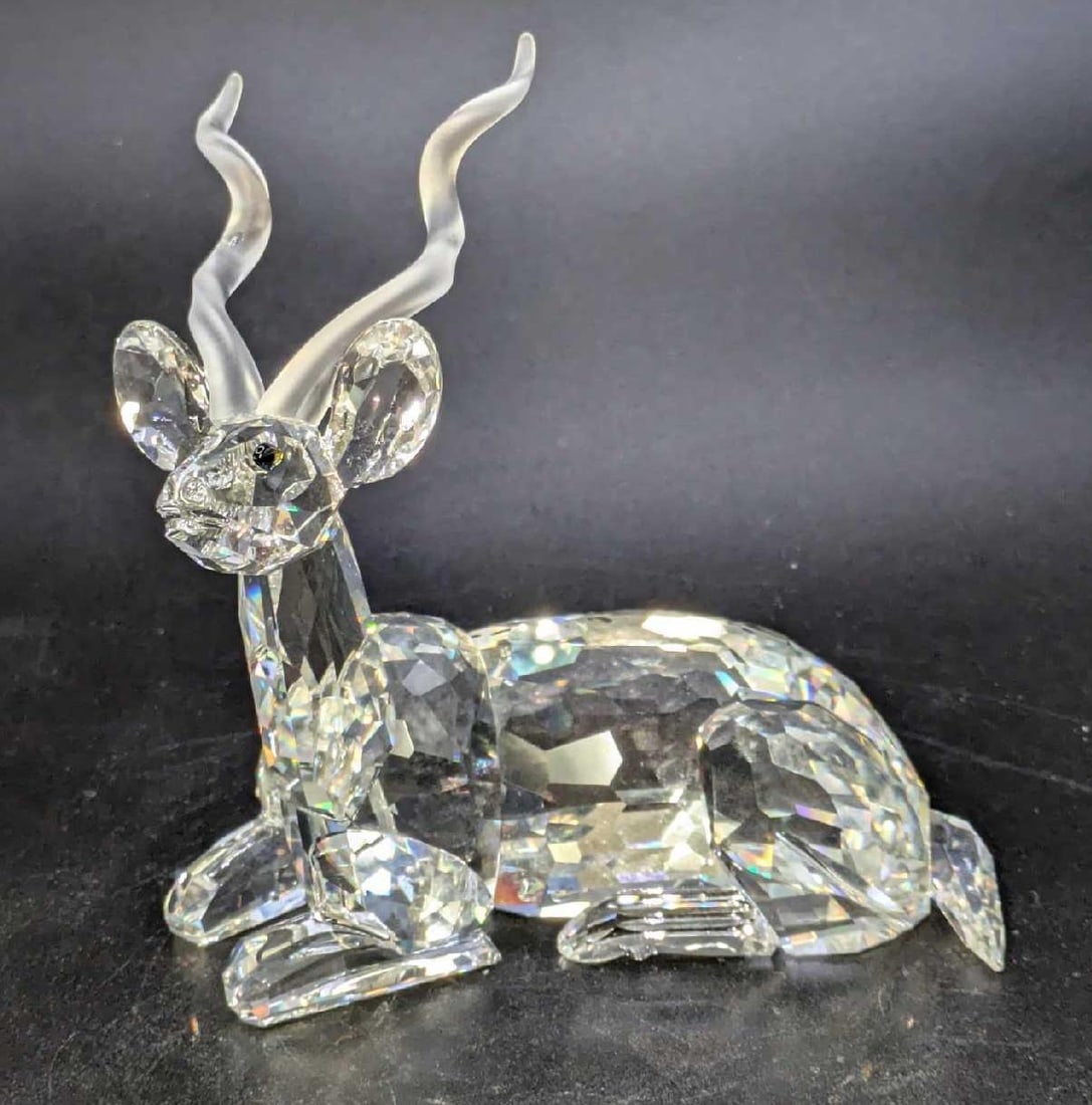 LE Swarovski Crystal Kudu Africa Series With Box: LE Swarovski Crystal Kudu Africa Series With Box. The Kudu is approx 4" x 2" x 4". It comes in the original box which is approx 7 1/2" x 7 1/2" x 6 1/2" and it weighs 1.37lb. T