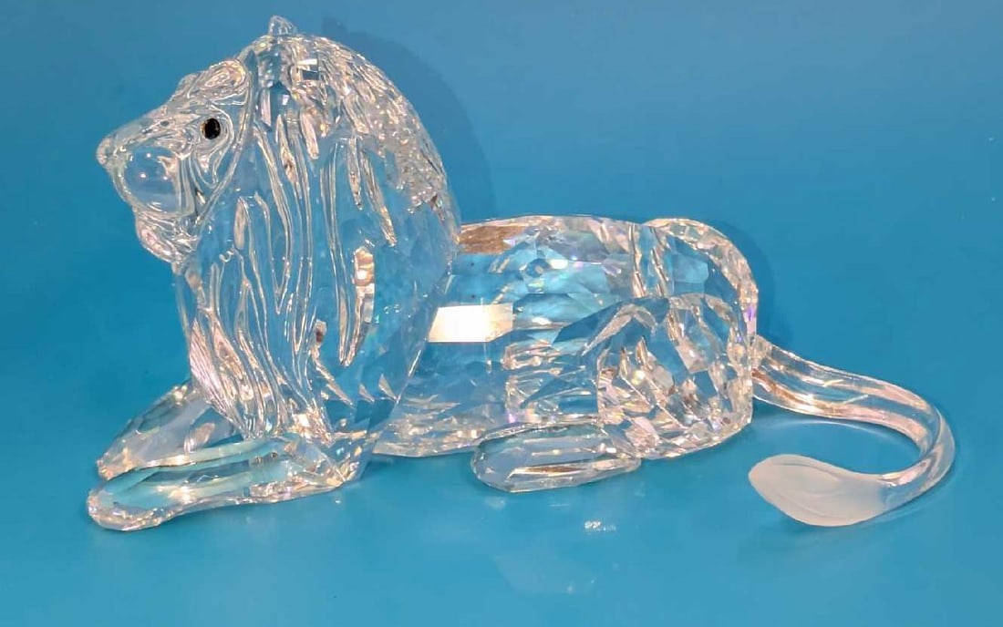 LE Swarovski Crystal Lion Inspiration Africa With Box: LE Swarovski Crystal Lion Inspiration Africa With Box. The Lion is approx 5" x 2 3/4" x 2 3/4". It comes in the original box which is approx 7 1/2" x 6 1/2" x 7 1/4" and it wei