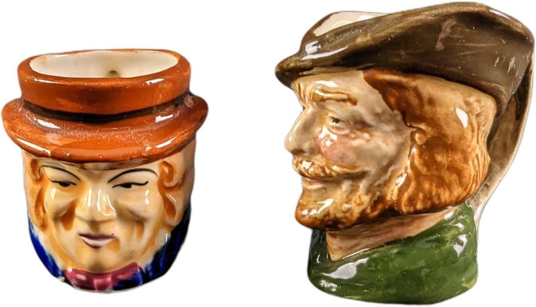Robin Hood & Colonial Man Character Creamers: This lot includes: (1) Robin Hood Creamer By Royal Doulton. This is approx 1 1/2" x 2 1/4" x 2 1/2". This has light wearing on the color. (1) Colonial Man Creamer Made In Japan. This is ap