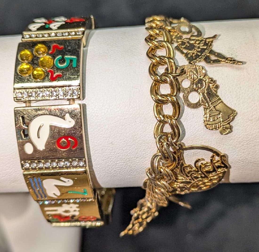 12 Days Of Christmas Stretch And Dangle Charm Bracelets: 12 Days Of Christmas Stretch And Dangle Charm Bracelets. This lot includes: (1) 12 Days Of Christmas Stretch Bracelet. By Kim Rogers. Gold tone bracelet is approx 2 3/4" x 2 3/4" x 3/8" and it weighs