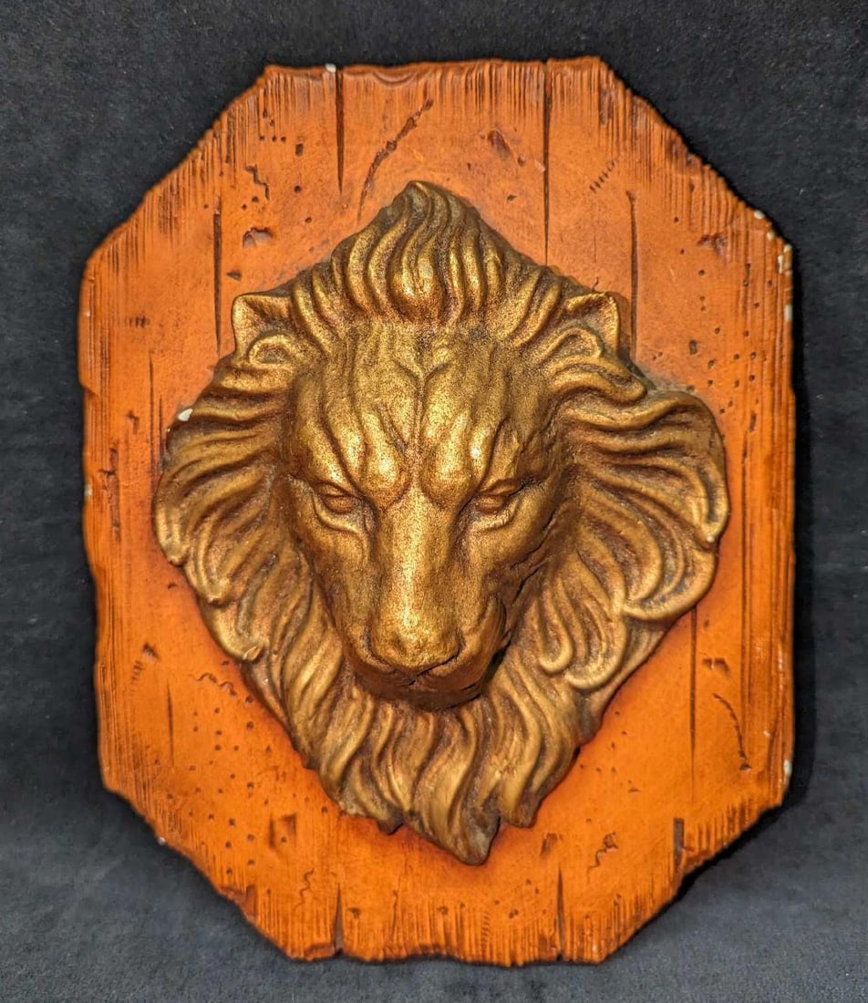 Vintage Plaster Lion Head Wall Plaque: Vintage Plaster Lion Head Wall Plaque. The maker and date of creation is unknown. Is approx 8" x 3 3/4" x 10 1/4" and it weighs 3.01lbs. Has small chips. Please see the images as they are part of the