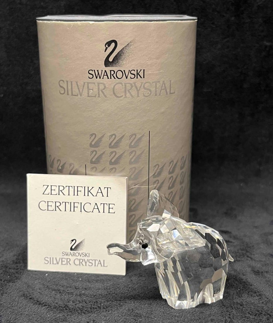 Swarovski Crystal Small Elephant 7640 In Original Box With Certificate: This lot contains a Swarovski Crystal Small Elephant 7640 In Original Box With Certificate. Approx Measurements are listed below. Total weight is approx 5.2oz. Overall the Swarovski Elephant is in exc