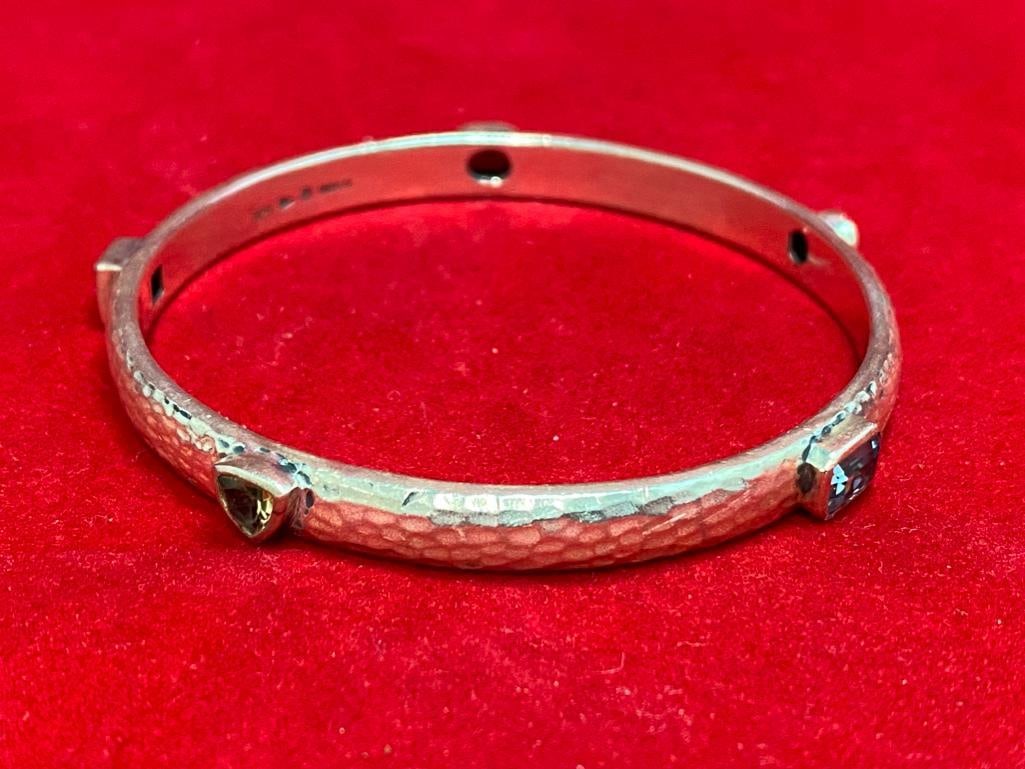 Sterling Multicolor Stone Bangle: This piece of jewelry as been tested and researched prior to testing . Please view all our pictures they are part of our description. DETAILS: Metal - 925 Sterling Silver Color - Silver Stones - Garne