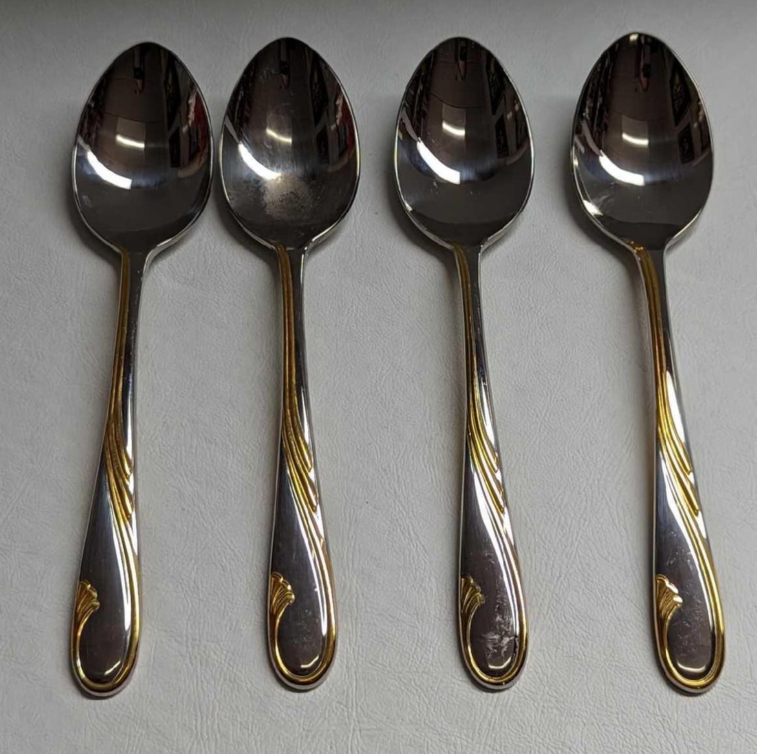 4 Retired Gorham Golden Swirl Oval Soup Spoons A: 4 Retired Gorham Golden Swirl Oval Soup Spoons A. This series was released by Gorham Silver from the year 1982 to the year 2001. These stainless steel spoons have signs of light wear with markings and