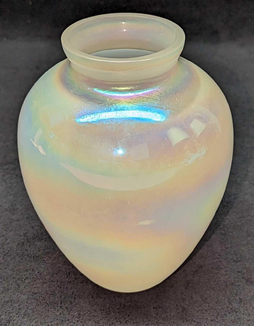 Vintage Iridescent Glass Vase: Vintage Iridescent Glass Vase. The maker and date of creation are unknown. The vase is approx 5" x 5' x 6 1/2" and it weighs 0.65lb. The vase has no chips or cracks.