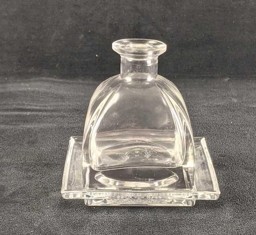 Fragrance Holder: Fragrance Holder This holder comes with its own little glass tray to sit on. you can fill it with essential oils or make it your own unique decoration. It is made of glass. There is no known damage.