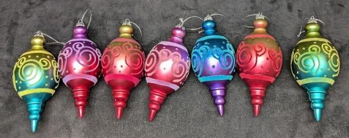 7 Disney Hidden Mickey Shatterproof Ornaments: 7 Disney Hidden Mickey Shatterproof Ornaments. Each colored shatterproof Christmas ornaments have hidden Mickeys swirls. Each is approx 2 1/2" x 2 1/2" x 6" and the total weight is 0.14lb.