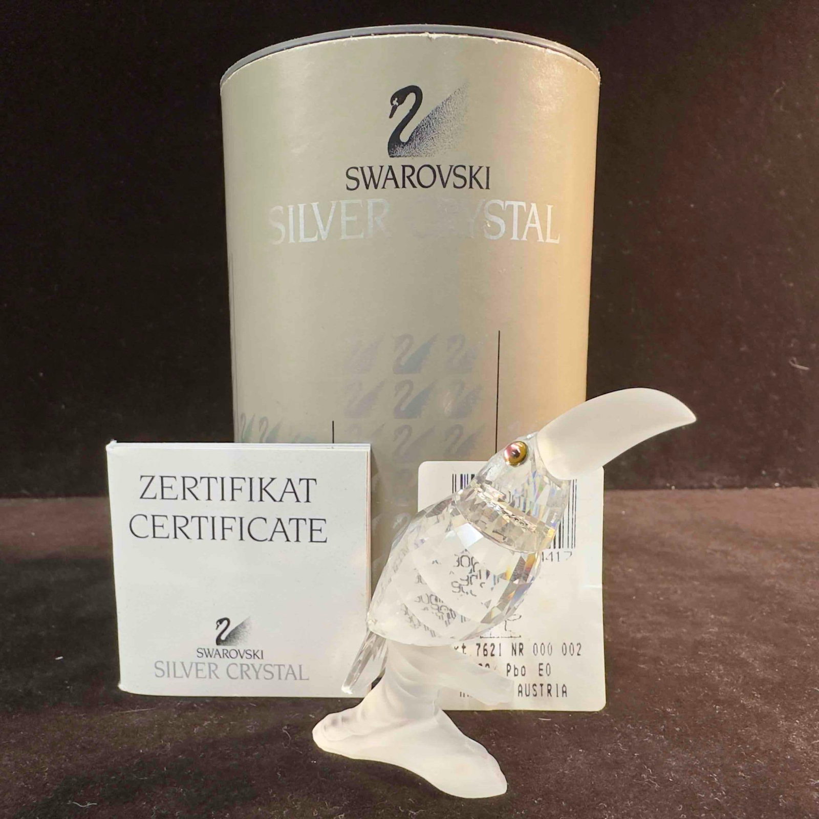 Swarovski Glass Toucan Up In The Trees Figurine 7621 NR 000 002: Swarovski Crystal Figurine Toucan. This figure is a beautiful crystal Toucan from Swarovski Crystal. The item is in great pre-owned condition with no noticeable damage. The gray foam packaging insert 