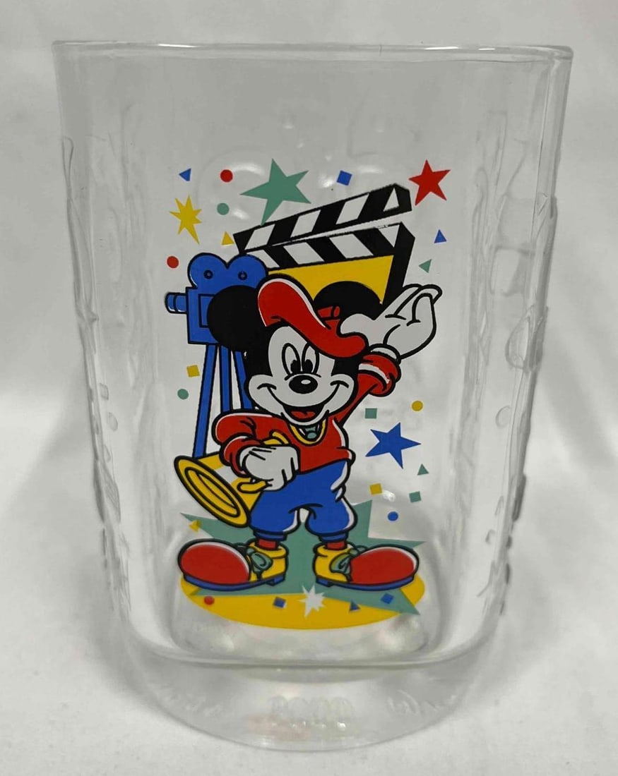 Walt Disney World Celebration 2000 McDonalds Glass Cup: This lot contains Walt Disney World Celebration 2000 McDonalds Glass Cup. It is approx 3 1/4" x 3 1/4" x 4 3/4" and it weighs about 0.8lbs. Overall the Disney/McDonald Glass cup is in good