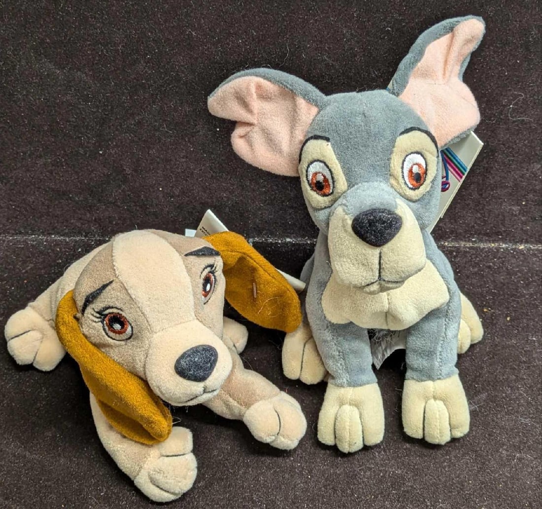 Disney Store Disney Lady & The Tramp Bean Bag Dolls: Disney Store Disney Lady & The Tramp Bean Bag Dolls. Lady is approx 5" x 7" x 3 1/4". Tramp is approx 5" x 7" x 6 1/2" and the total weight is 0.52lb. The dolls have some w