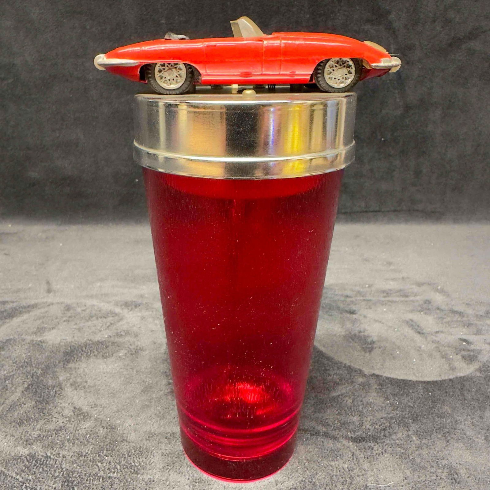 Barware Cocktail Shaker Mixer Jaguar Roadster Battery Operated Red: Barware Cocktail Shaker Mixer Jaguar Roadster Battery Operated Red. Made in japan vintage barware featuring a Jaguar red convertible roadster. Item requires two (2) AA batteries. (not included). Item