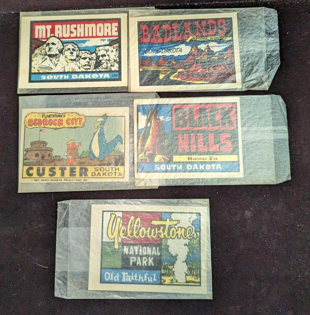 5 Vintage Tourism Baxter Lane Dip Decals: 5 Vintage Tourism Baxter Lane Dip Decals. Each is in its original package that is approx 5 1/2" x 3" and the total weight is 0.02lb. This lot includes: The Badlands, Mt. Rushmore, Flintstones 