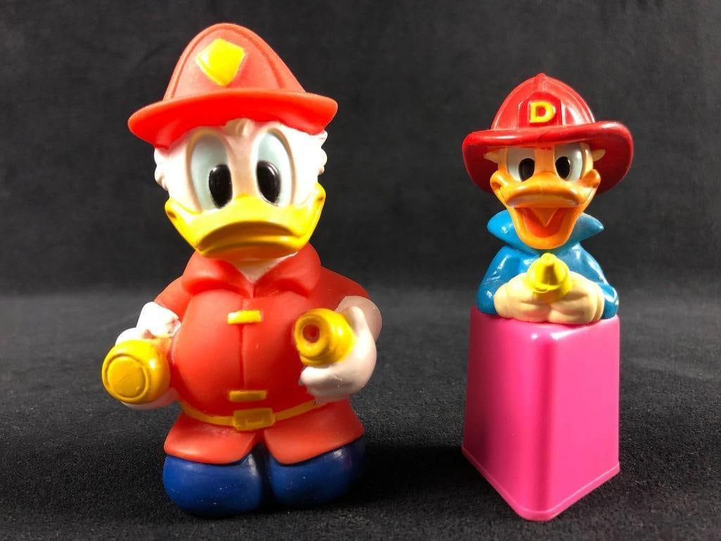 Vintage Donald Duck Fireman Figurines Rubber Bath Toy: Vintage Donald Duck Fireman Figurines Rubber Bath Toy. This lot of Donald Duck items is in overall good used condition. The items show minor signs of discoloration from age. The two items in this lot 