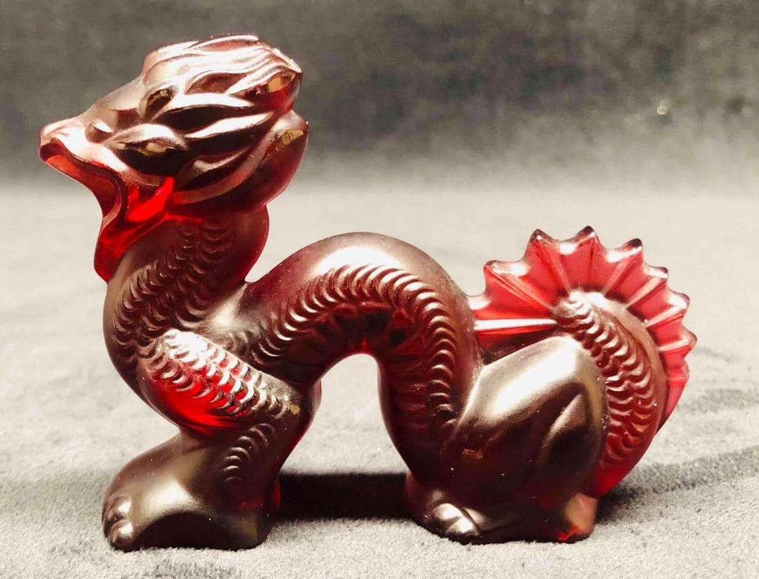 Lalique Signed Red Dragon: This lot contains Lalique Signed Red Dragon. It is approx 4" x 1 1/4" x 2 3/4" and it weighs about 0.4lbs. Overall the Lalique Dragon is in good used condition with some light wear from us