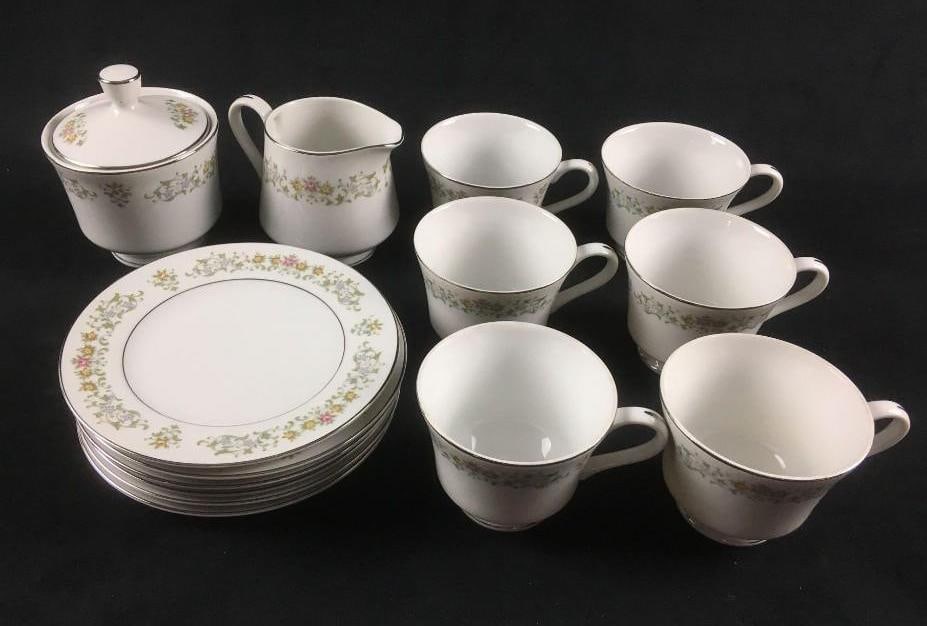 Petit Fleur by Rose Fine China Dinnerware: This set of Japanese dinnerware from Japan has a Pink/Yellow/Blue Flowers, Platinum Trim Design and includes: (6) Bread & Butter Plates. These are approx 6 3/8" x 6 3/8". (6) Footed Cups.