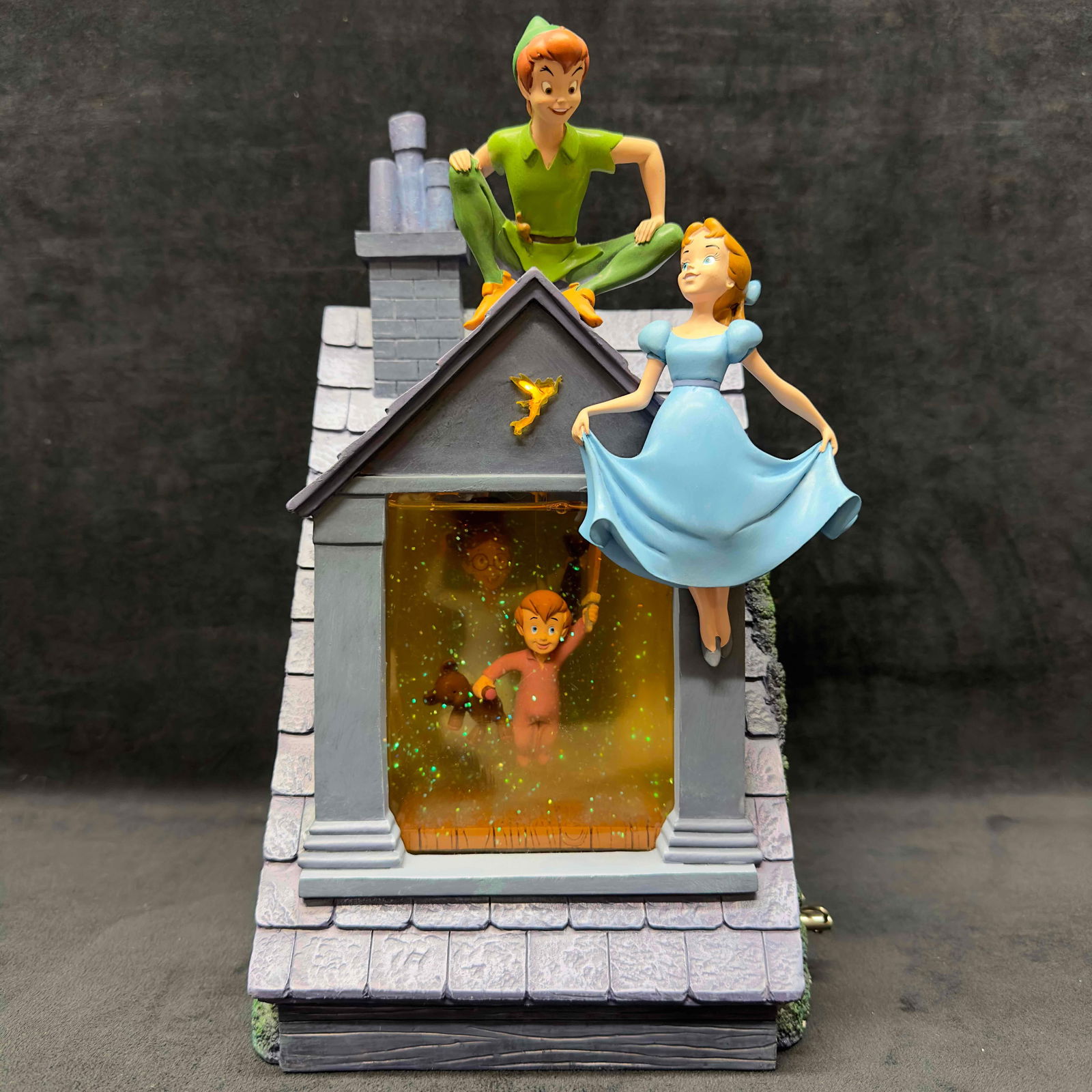 Disney Peter Pan You Can Fly Darling House Musical Snow Globe: Disney Peter Pan You Can Fly Darling House Musical Snow Globe. This Disney Store musical snow globe features Peter Pan, Wendy, John, and Micheal Darling in the You Can Fly house scene. The music box p
