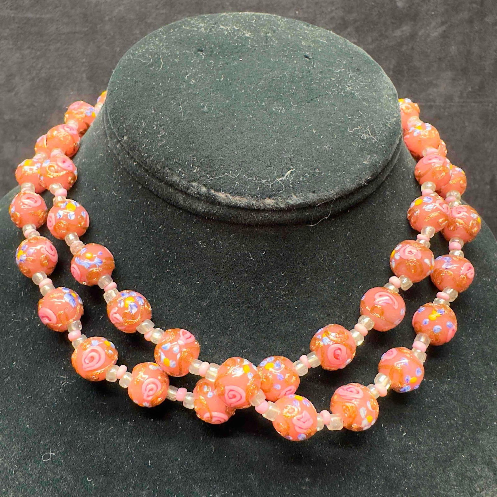 Murano Venetian Art Glass Lamp Work Fiorato Round Pink Floral Beaded Choker Necklace B84: Murano Venetian Art Glass Lamp Work Fiorato Round Pink Floral Beaded Choker Necklace B84. Necklace with pink glass beads with beautiful designs on each. The necklace features floral accents. Necklace 