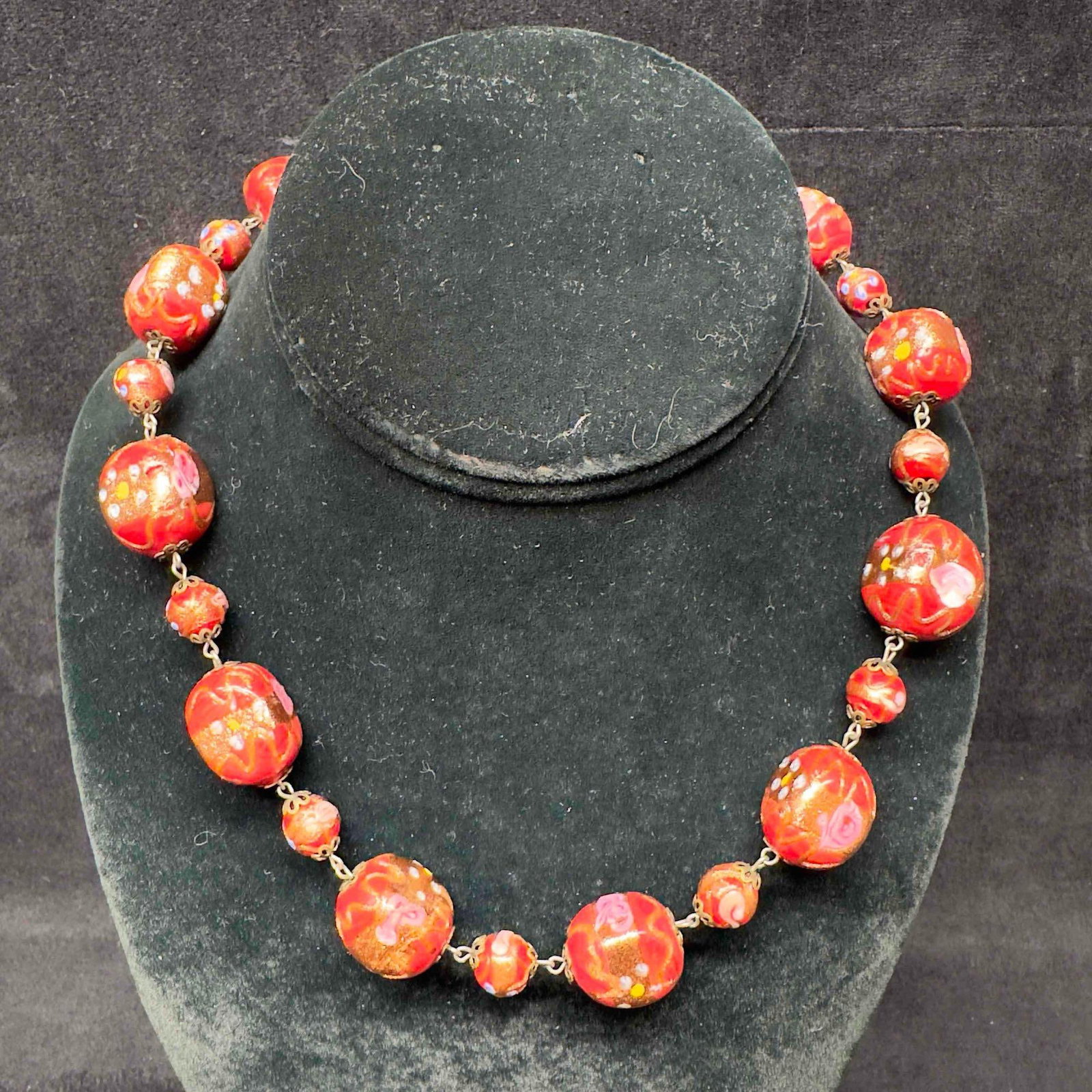 Venetian Murano Lamp Work Art Glass Fiorato Bead Floral Red Beaded Necklace B89: Venetian Murano Lamp Work Art Glass Fiorato Bead Floral Red Beaded Necklace B89. Necklace with red colored glass beads with beautiful hand painted designs on each. The necklace features floral accents
