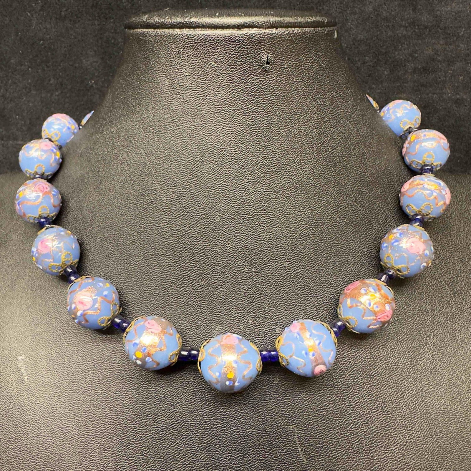 Murano Venetian Art Glass Lamp Work Bead Blue Floral Beaded Fiorato Necklace C9: Murano Venetian Art Glass Lamp Work Bead Blue Floral Beaded Fiorato Necklace C9. Necklace with blue colored glass beads with beautiful hand painted designs on each. The necklace features floral accent