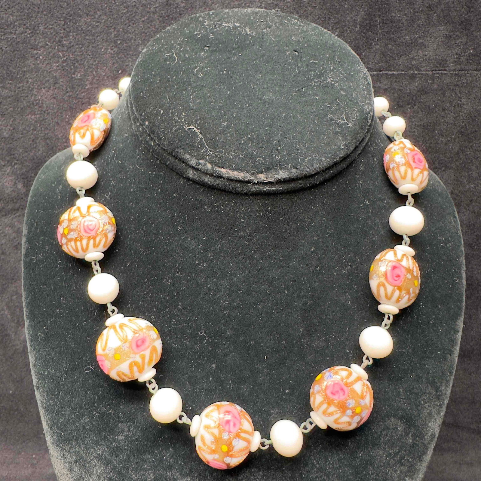 Venetian Murano Lamp Work Art Glass Fiorato Beaded White Floral Necklace B80: Venetian Murano Lamp Work Art Glass Fiorato Beaded White Floral Necklace B80. Necklace with white colored glass beads with beautiful hand painted designs on each. The necklace feature floral pink acce