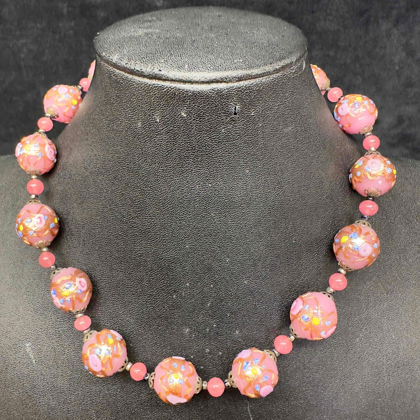 Venetian Murano Lamp Work Glass Round Pink Wedding Cake Bead Necklace: Venetian Murano Lamp Work Glass Round Pink Wedding Cake Bead Necklace. Necklace with pink colored glass beads with beautiful hand painted designs on each. This item is in good pre-owned, previously di
