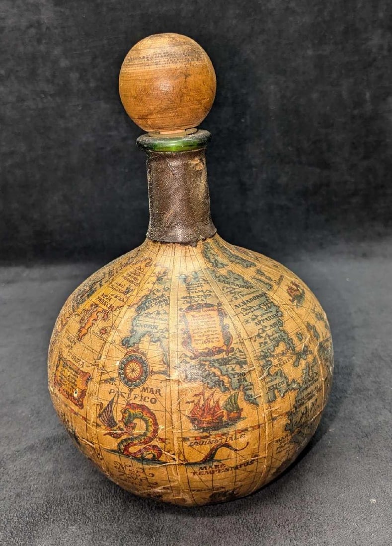 Vintage Italian Green Glass Decanter Covered With Map: Vintage Italian Green Glass Decanter Covered With Map. This is approx 7" x 7" x 10" and it weighs 2.06lb.The paper map has some rips and folds due to age and storage. Please see the images