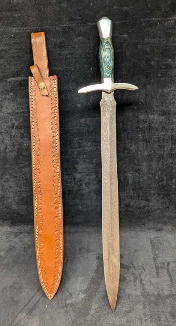 Lahoma Oklahoma Damascus Steel Sword With Scabbard: Lahoma Oklahoma Damascus Steel Sword With Scabbard. This is approx 5 3/4" x1 1/4" x 28 1/2" and it weighs 1.80lb. There is some wear on the hilt and the damascus steel is darkening/very li