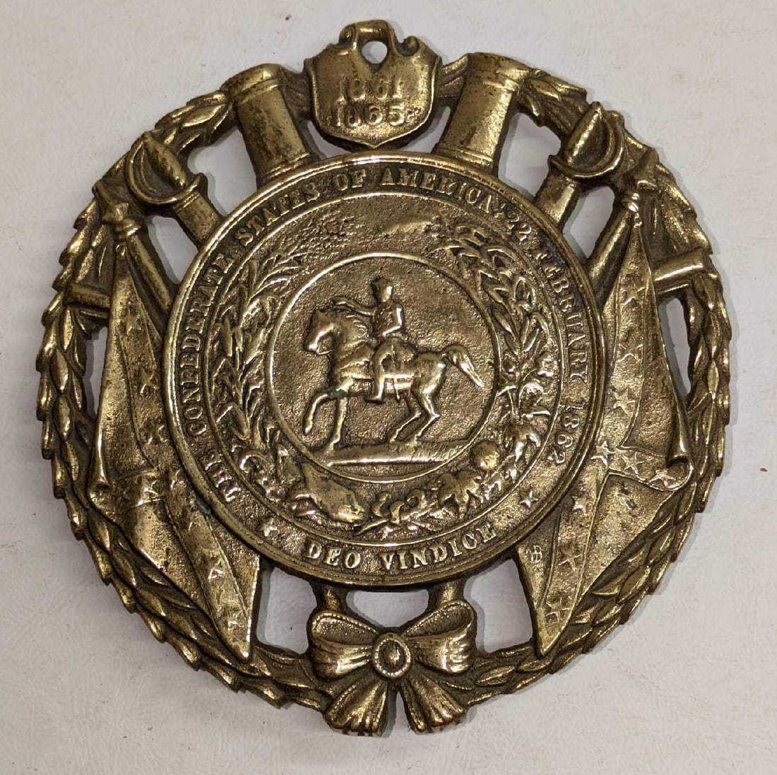 Vintage Confederate States of America Brass Trivet: Vintage Confederate States of America Brass Trivet. This is approx 5 1/8" x 5 1/4" x 1/2" and it weighs 0.77lb. The trivet has some light tarnish and signs of wear. This was copyrighted in