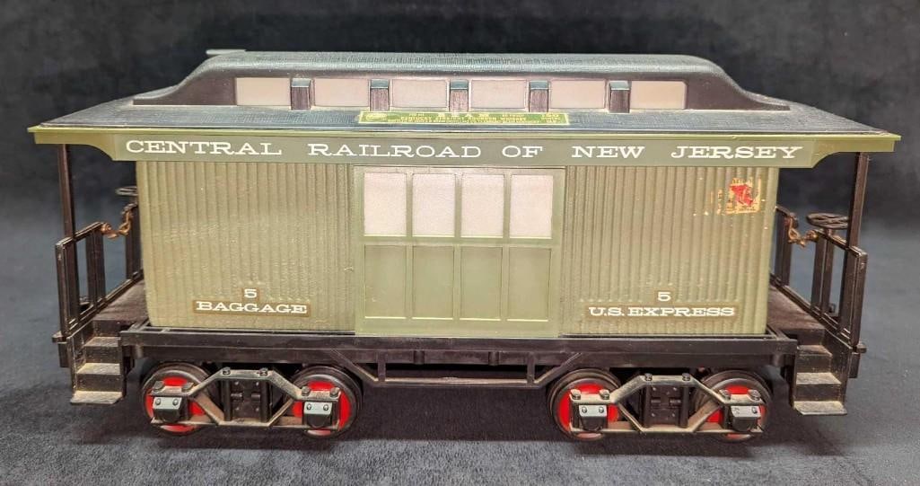 Vintage Jim Beam's Baggage Car Porcelain Decanter: Vintage Beams Baggage Car Porcelain Decanter. It comes in its original box that is approx 17 3/4" x 6 1/2" x 8 3/4" and it weighs 7.10 lbs. The box has some shelf wear and tape. The decant