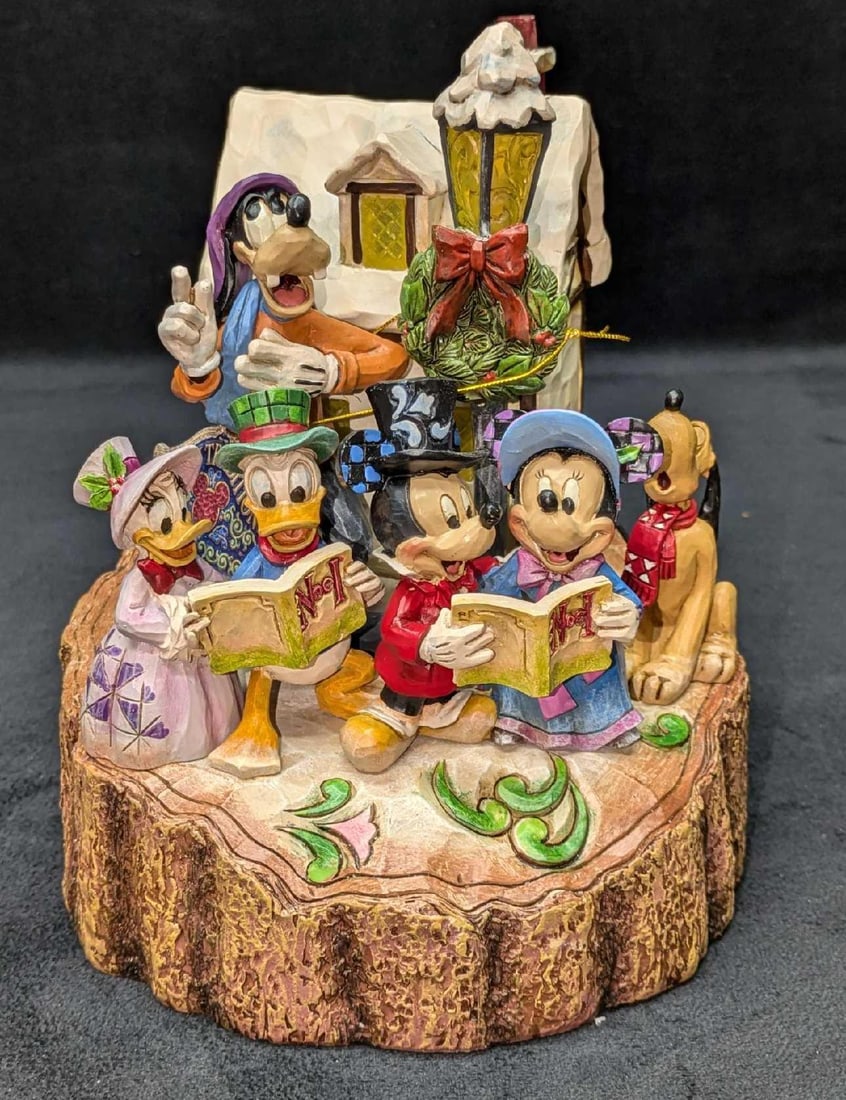 Jim Shore Signed Disney Holiday Harmony Figurine: Jim Shore Signed Disney Holiday Harmony Figurine. This resin figurine requires two AA batteries (Not included) that will light up the lantern. The figurine comes in the original box that is approx 8&#