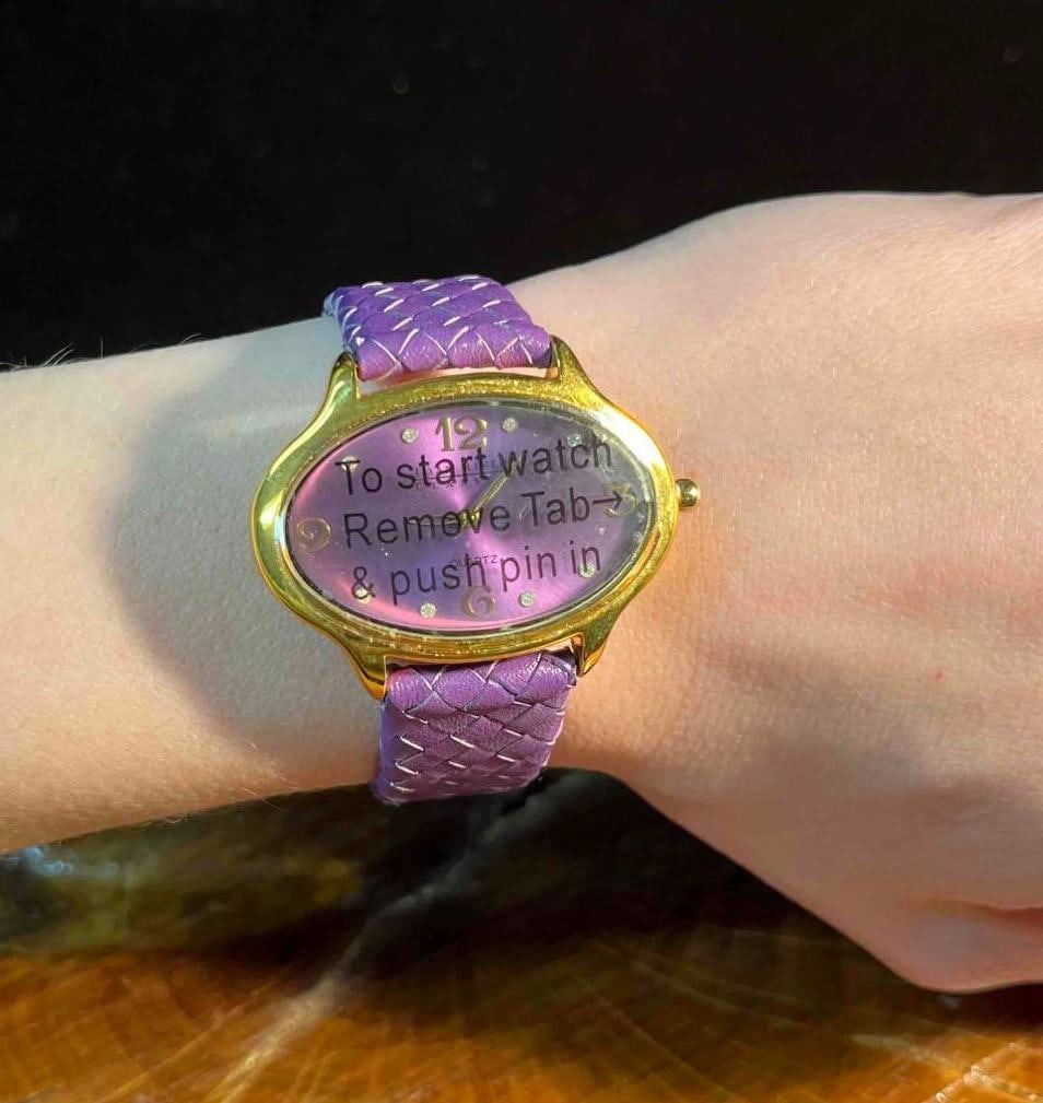 Joan Rivers Classics Purple & Gold Tone Watch With Genuine Leather Band: This lot contains a Joan Rivers Classics Purple & Gold Tone Watch With Genuine Leather Band. It is approx 9 1/4" x 1 3/4" x 1/4". Total weight is approx 1oz. Overall the Joan Rivers Wa