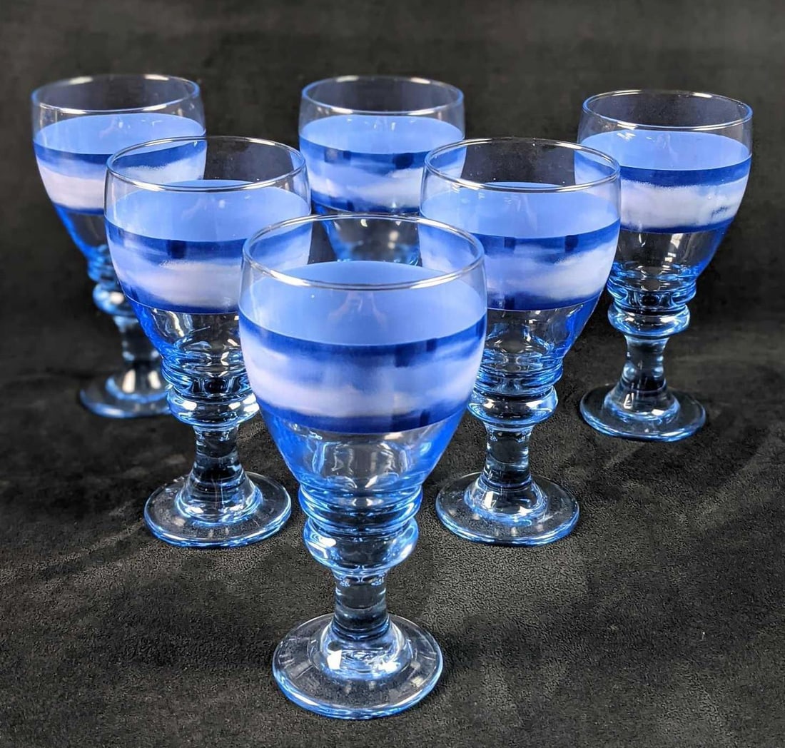 Six Blue Glass Water Goblets With Stripe B: Six Blue Glass Water Goblets. Each has a nice blue stripe near the top. Each goblet is approx 4" x 4" x 7 1/4" and is in a good, unused condition with no known damage. The maker and time o